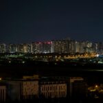 Explore the vibrant night skyline of Hsinchu, Taiwan with glowing city lights.